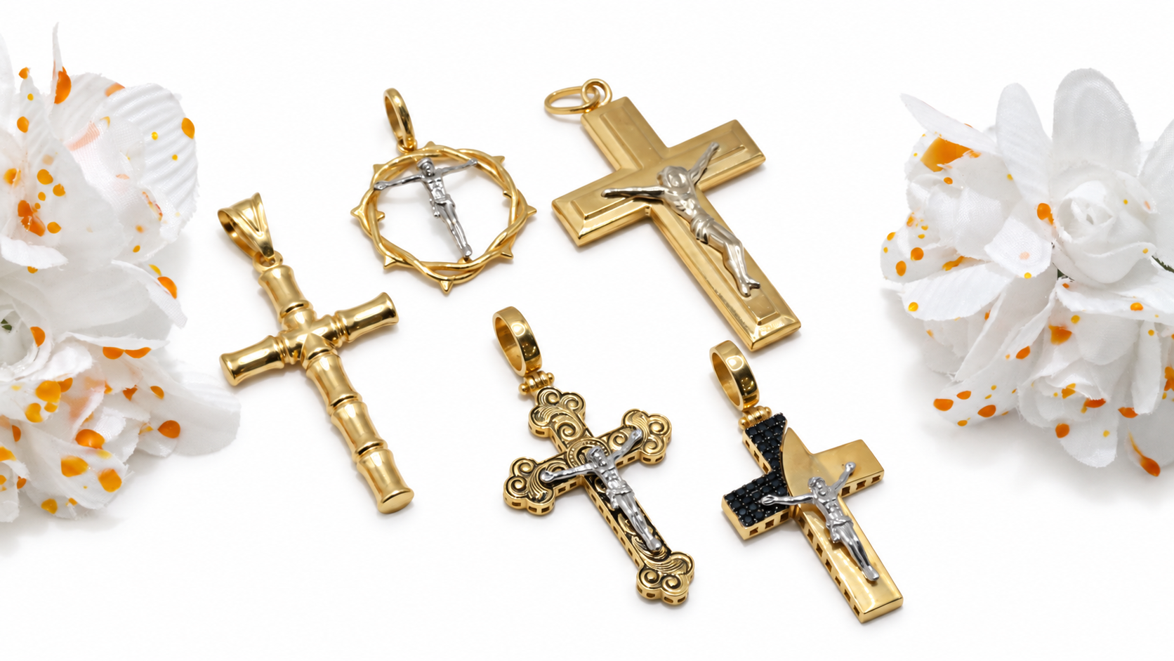 Gold and two-tone cross pendants arranged with white flowers