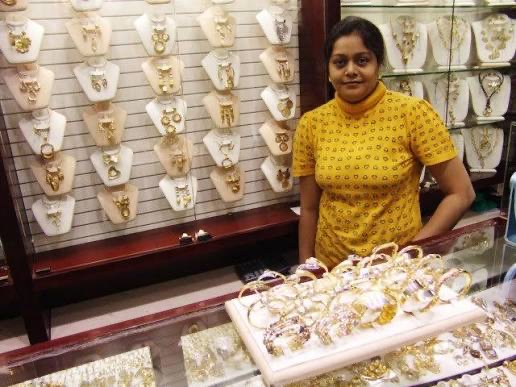 A member of Roza behind a jewellery counter