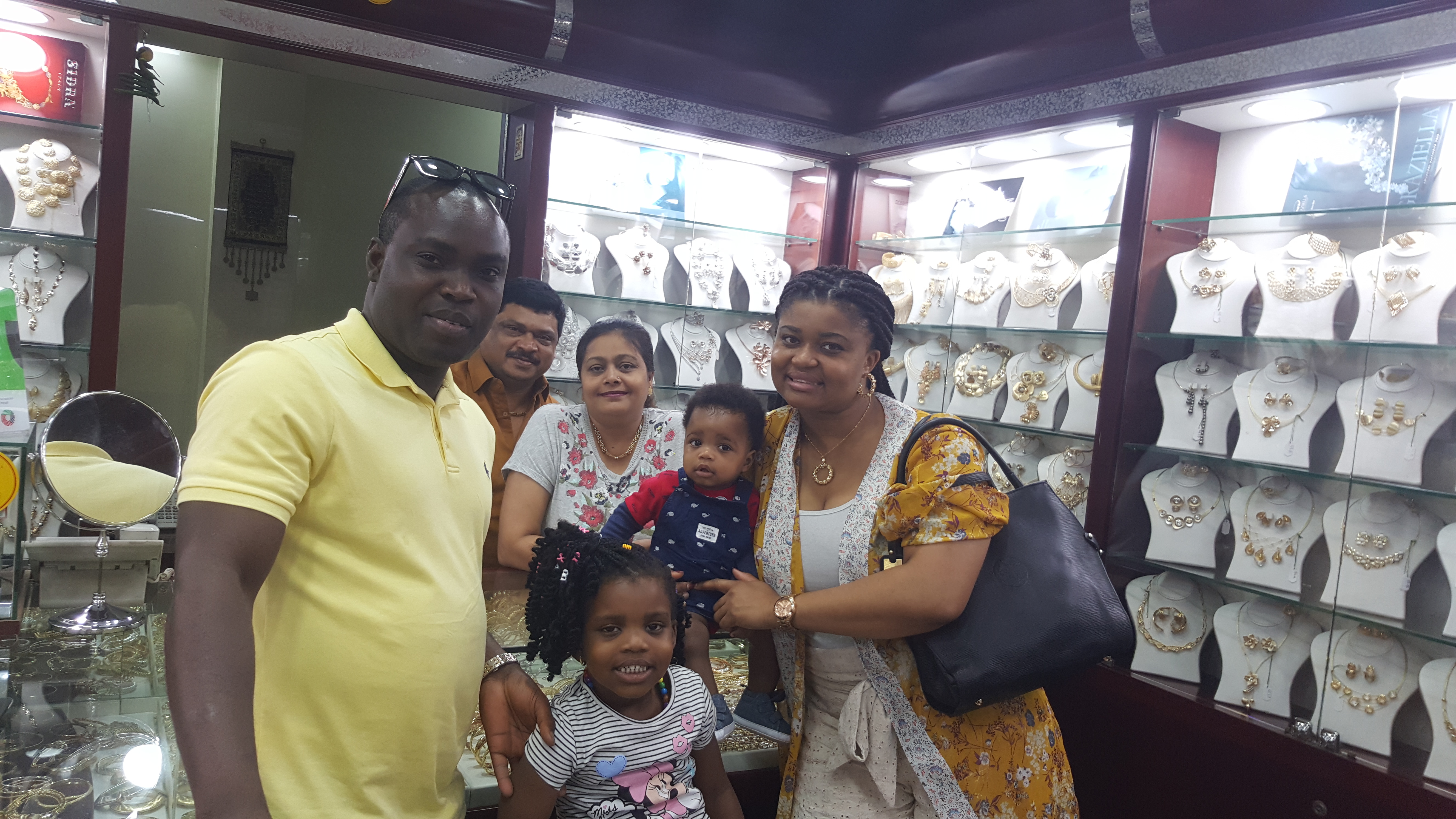A family visiting Roza inside the jewellery shop