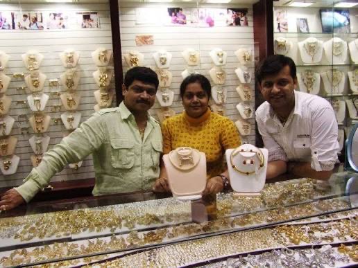 Three members of the Roza team behind the jewellery counter